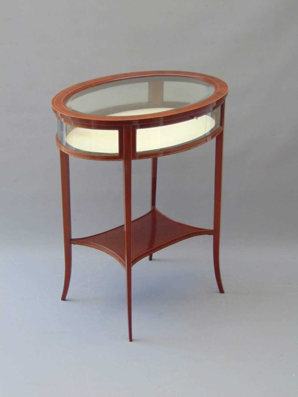 A MAGOGANY OVAL BIJOUTRERIE TABLE  View III