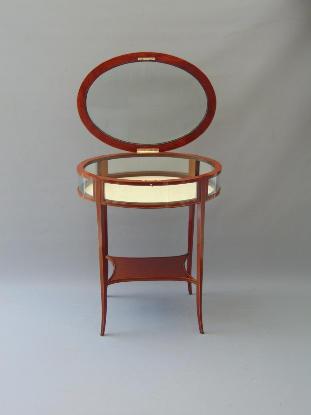 A MAGOGANY OVAL BIJOUTRERIE TABLE  View IV