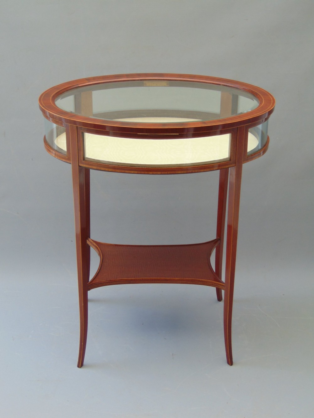 A MAGOGANY OVAL BIJOUTRERIE TABLE  View V