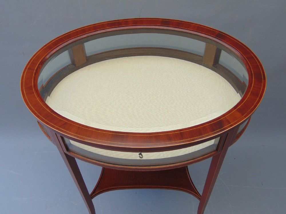 A MAGOGANY OVAL BIJOUTRERIE TABLE  View VI