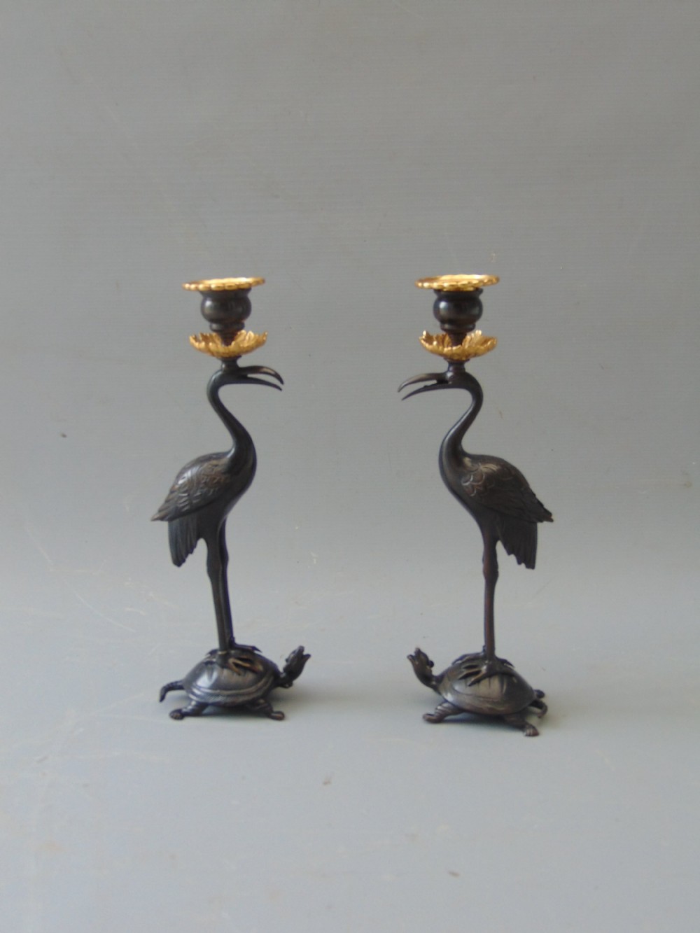 A  good Pair of  Gilt Bronze Stork Candlesticks 