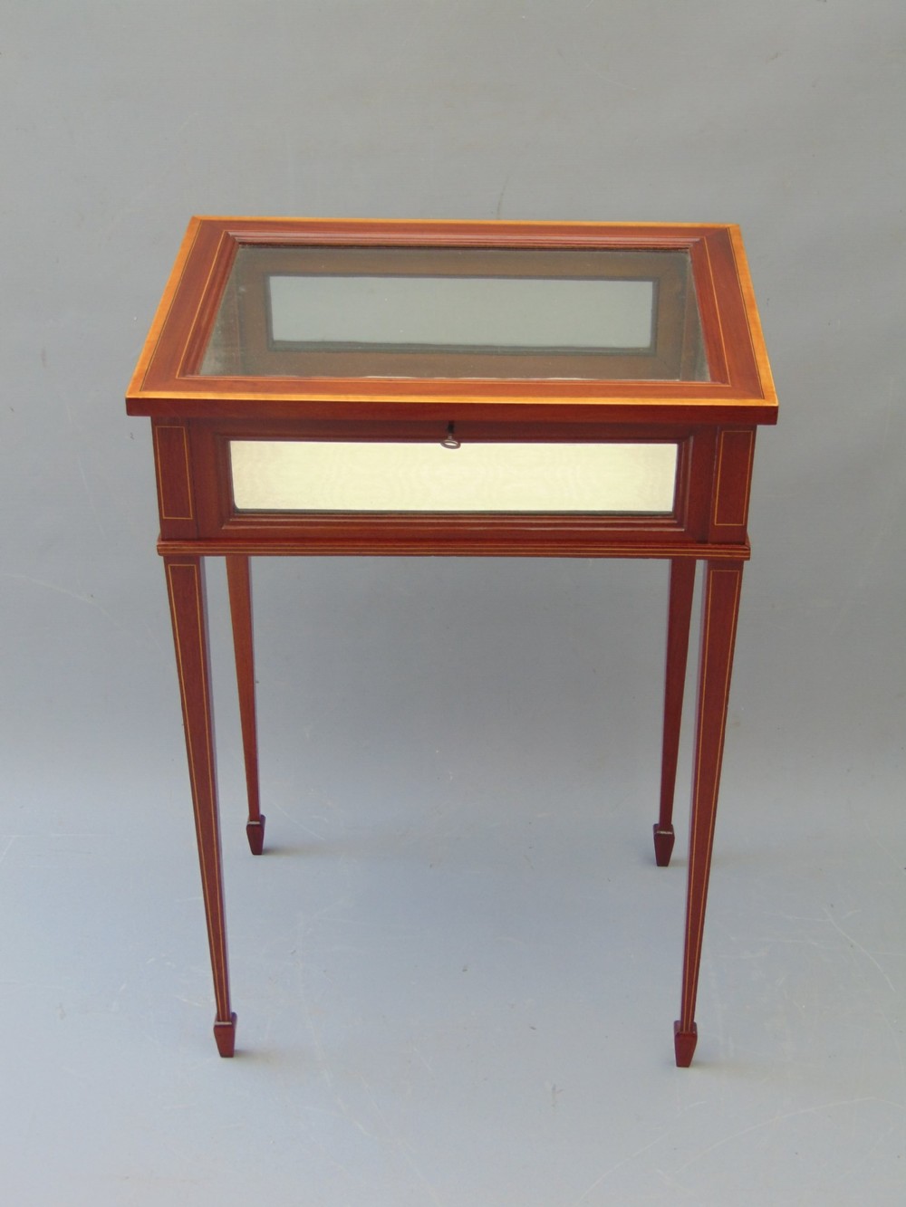 A MAGOGANY INLAID BIJOUTERIE TABLE cabinet