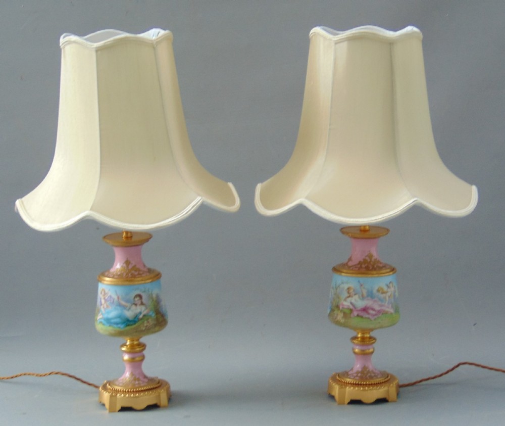 A superb pair of Sevres porcelain hand painted table lamps 