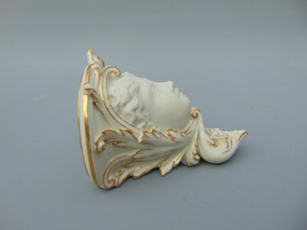 A pair of wall brackets  View III