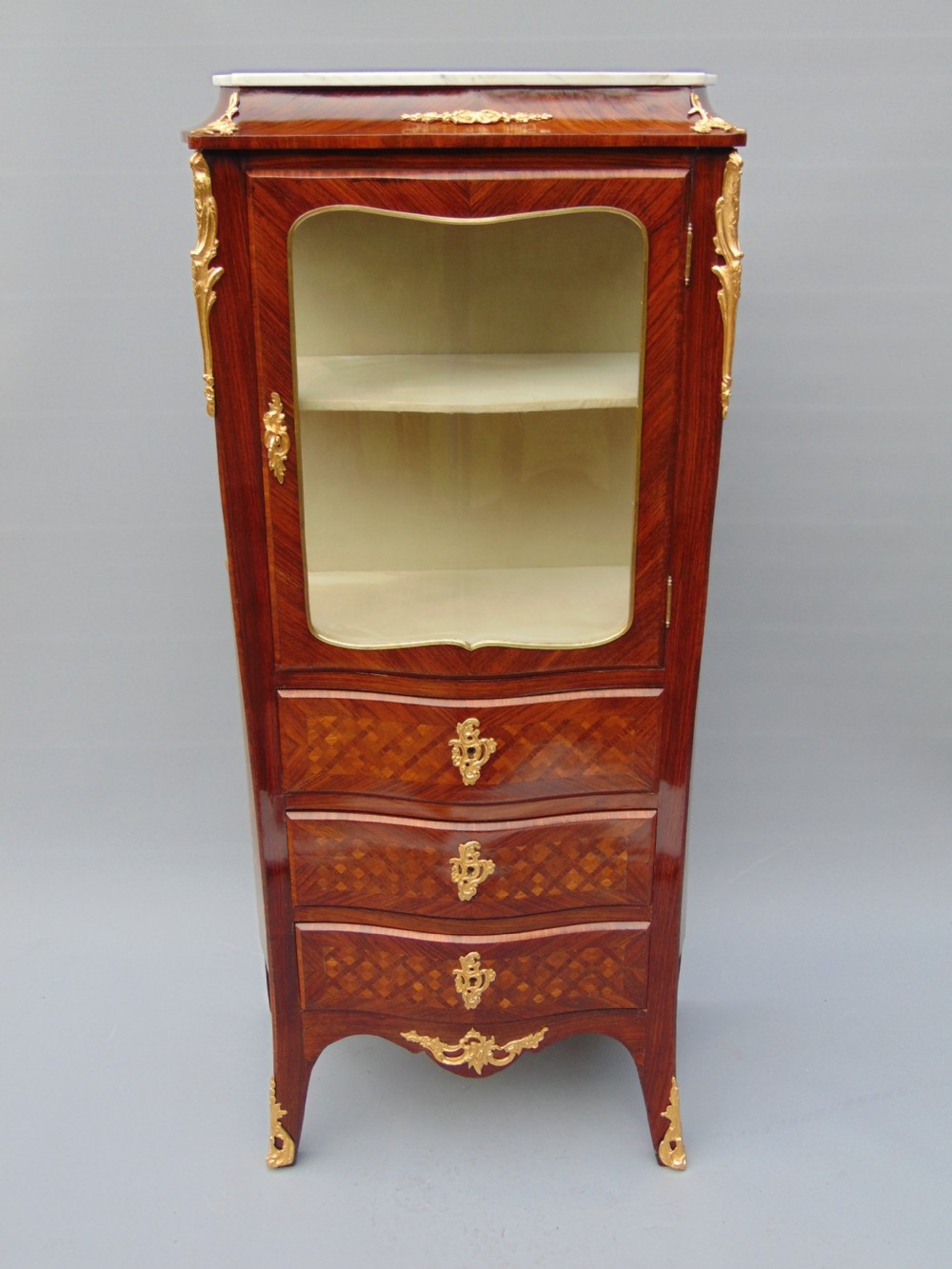 A small rosewood display cabinet 