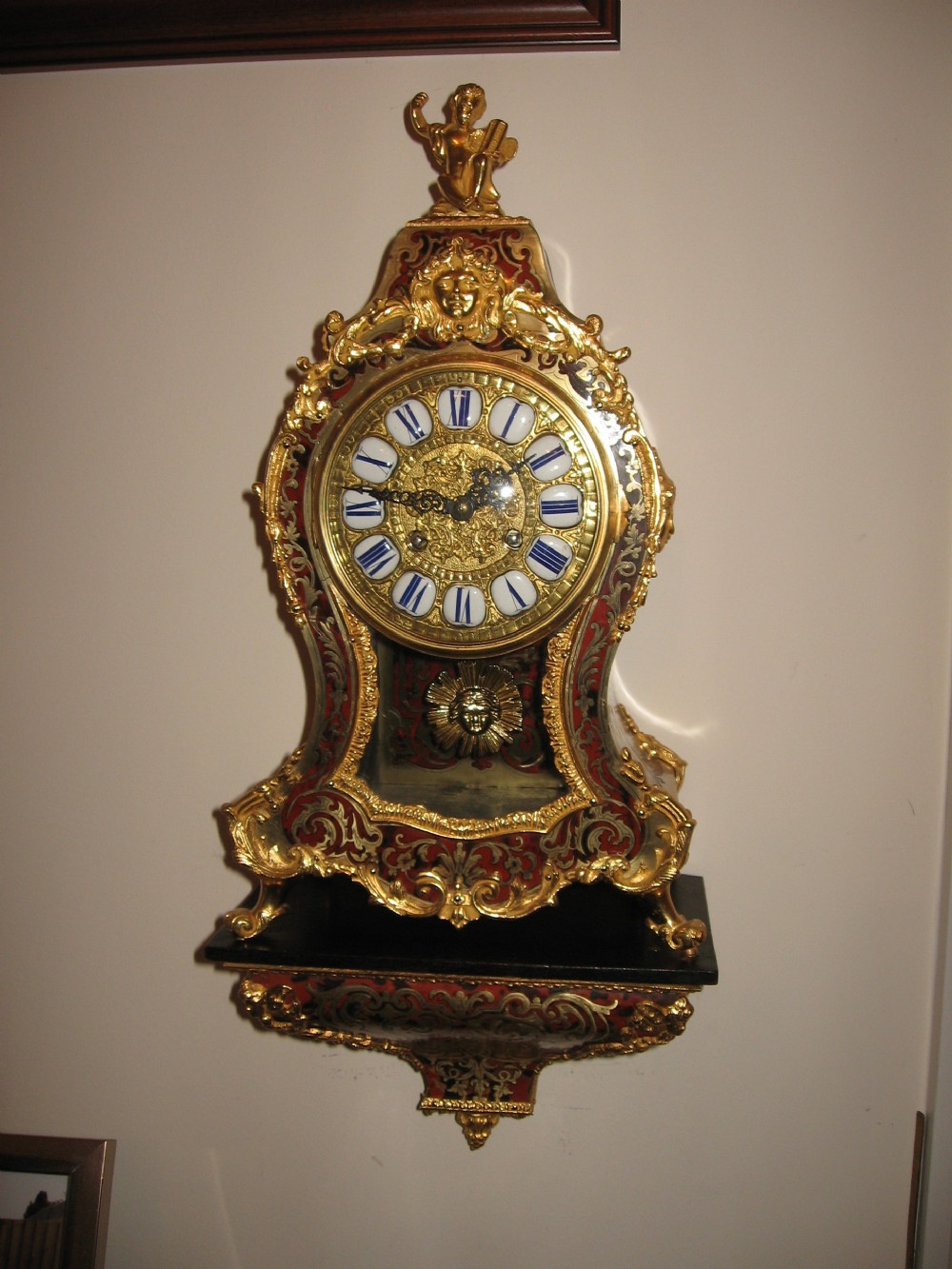Antique red boulle clock and bracket View VI