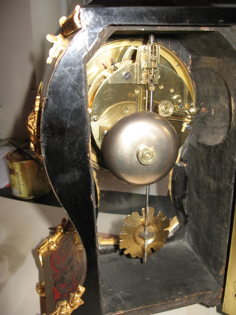 Antique red boulle clock and bracket View X
