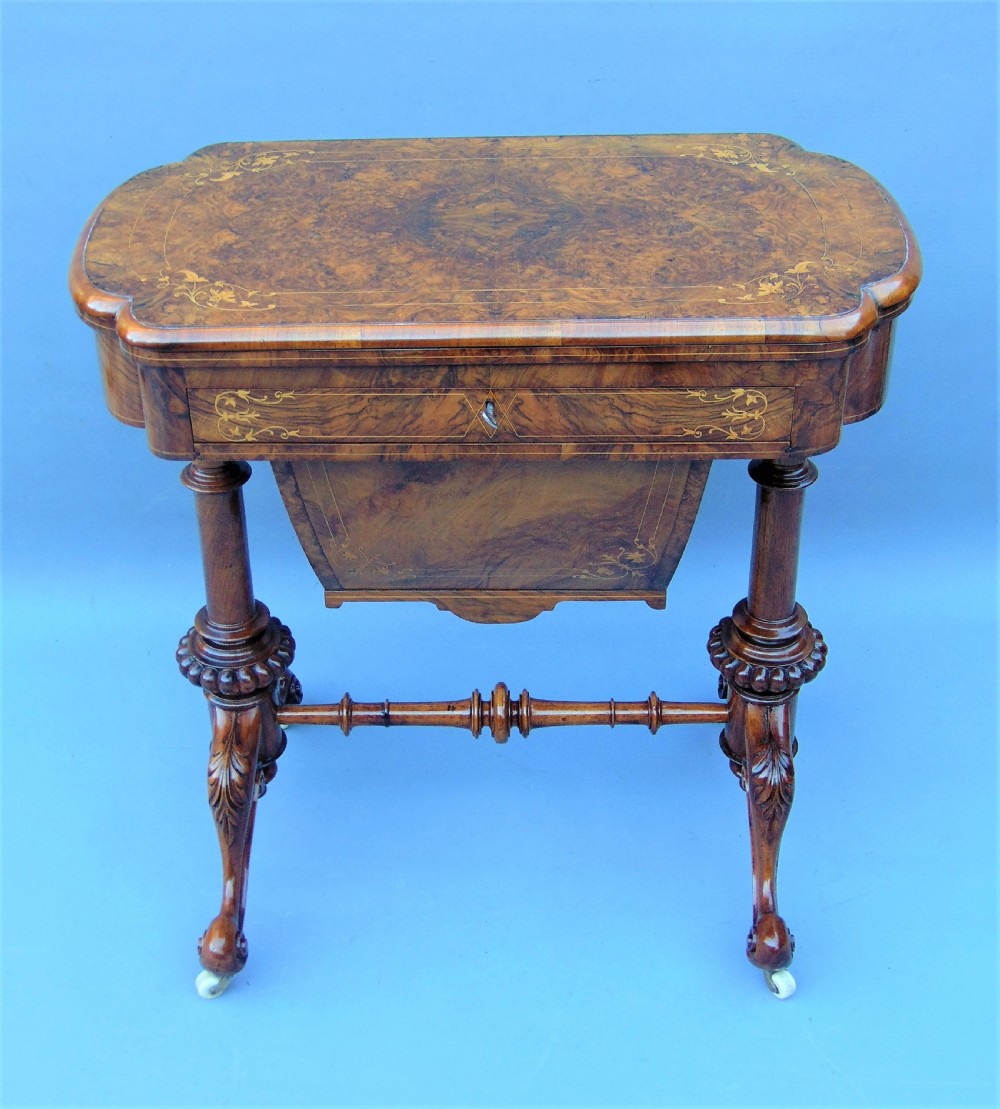 A fine English inlaid Burr Walnut Sewing games Table