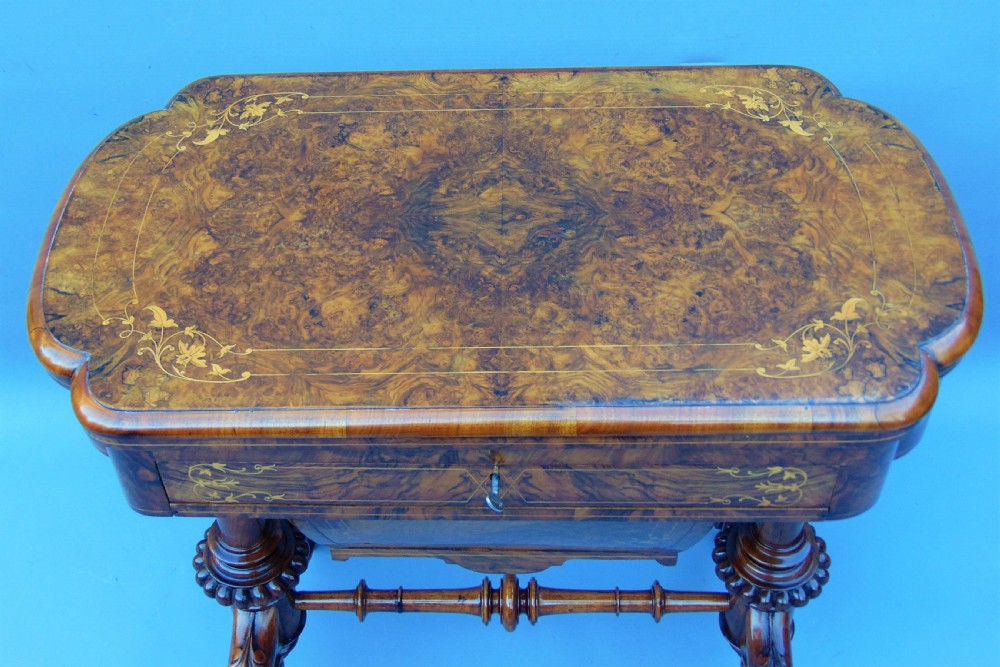 A fine English inlaid Burr Walnut Sewing games Table View IV