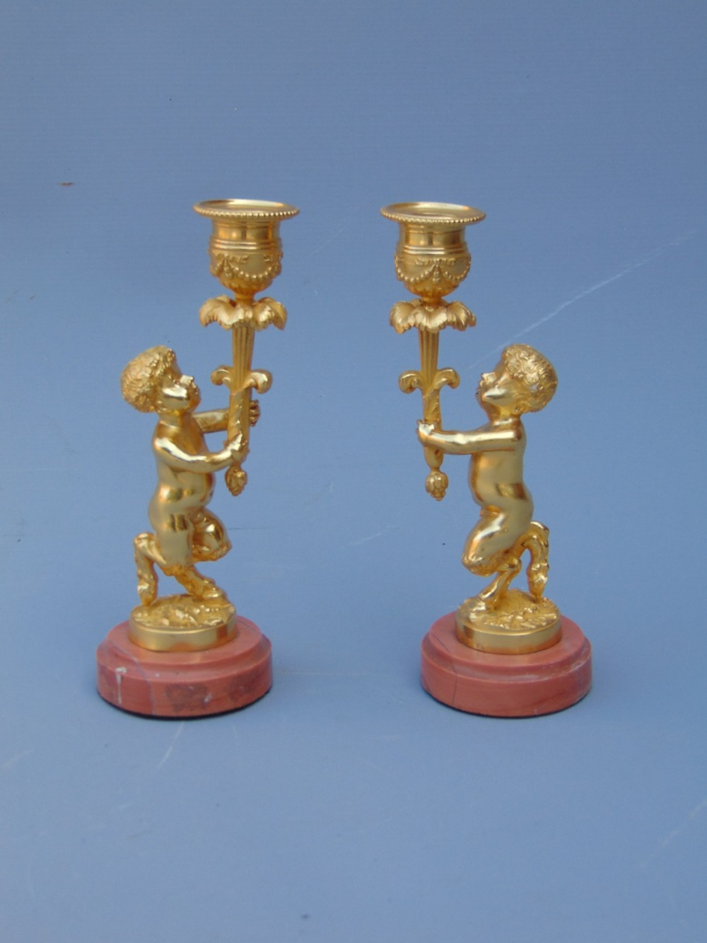 A small pair of ormolu candlesticks 