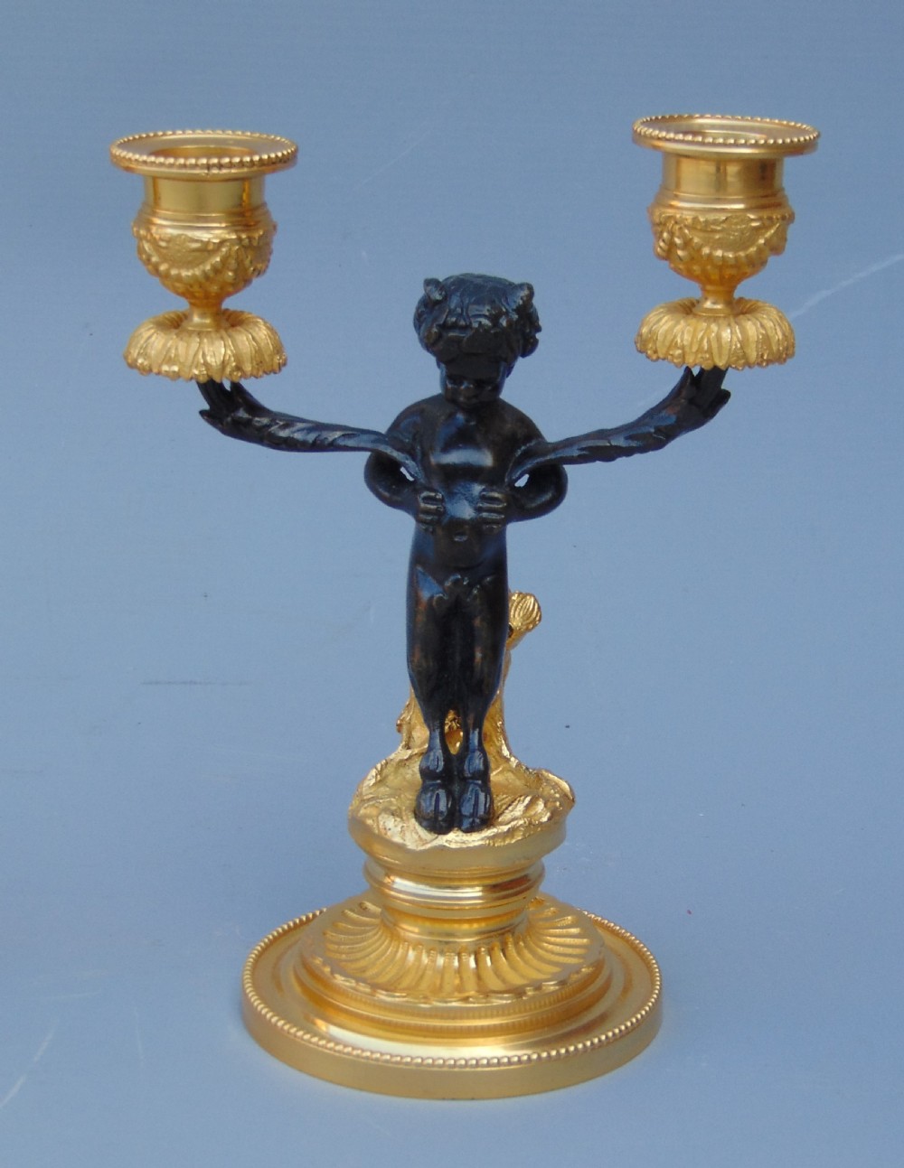 A pretty pair of cherub Candlesticks  View II