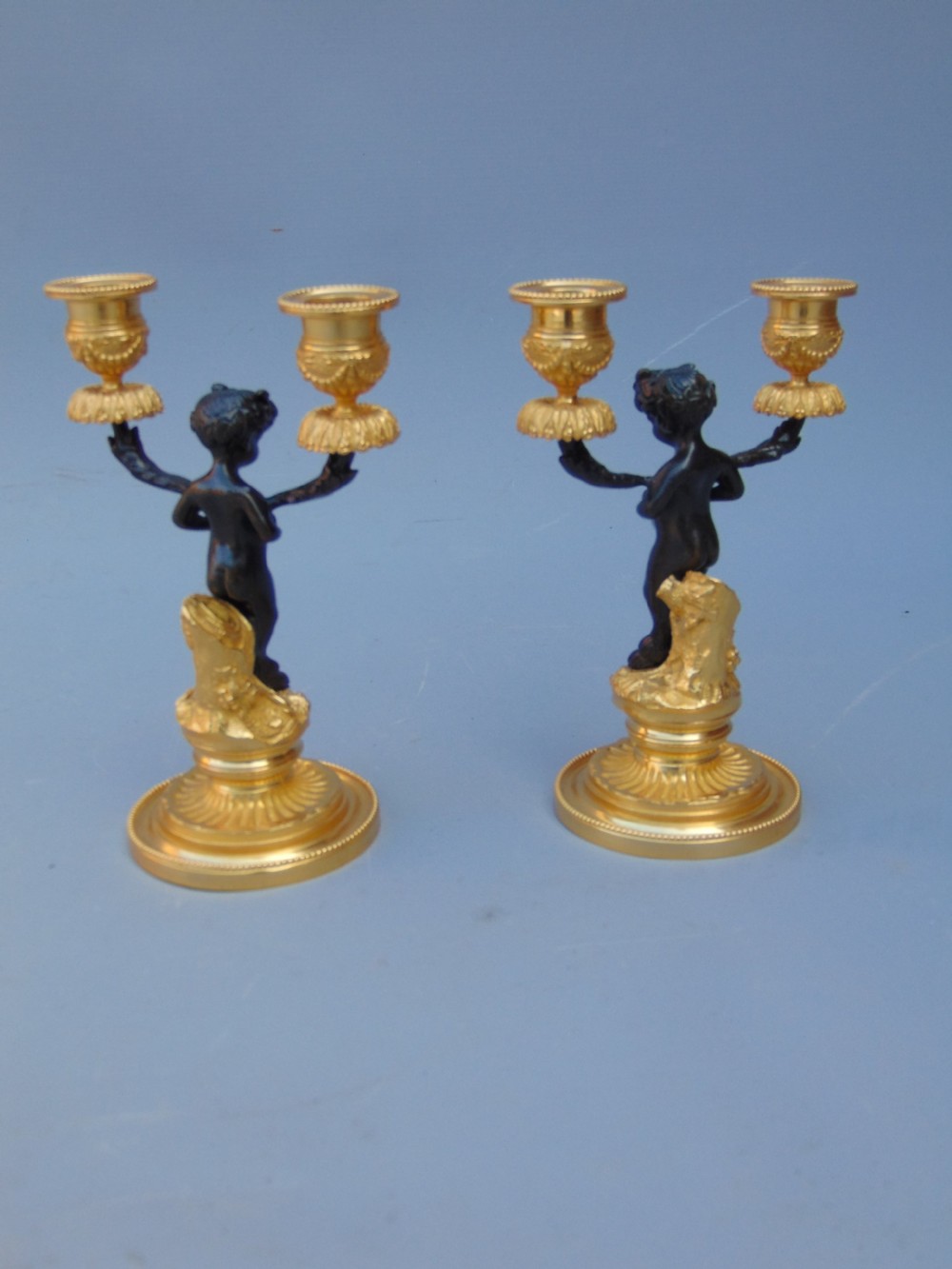A pretty pair of cherub Candlesticks  View IV