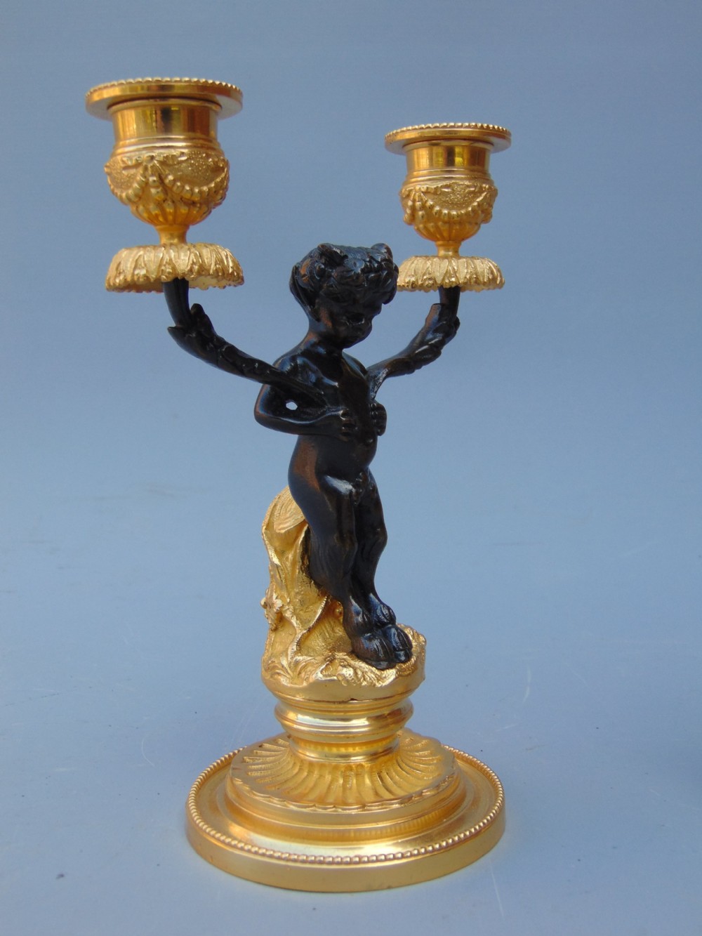 A pretty pair of cherub Candlesticks  View V