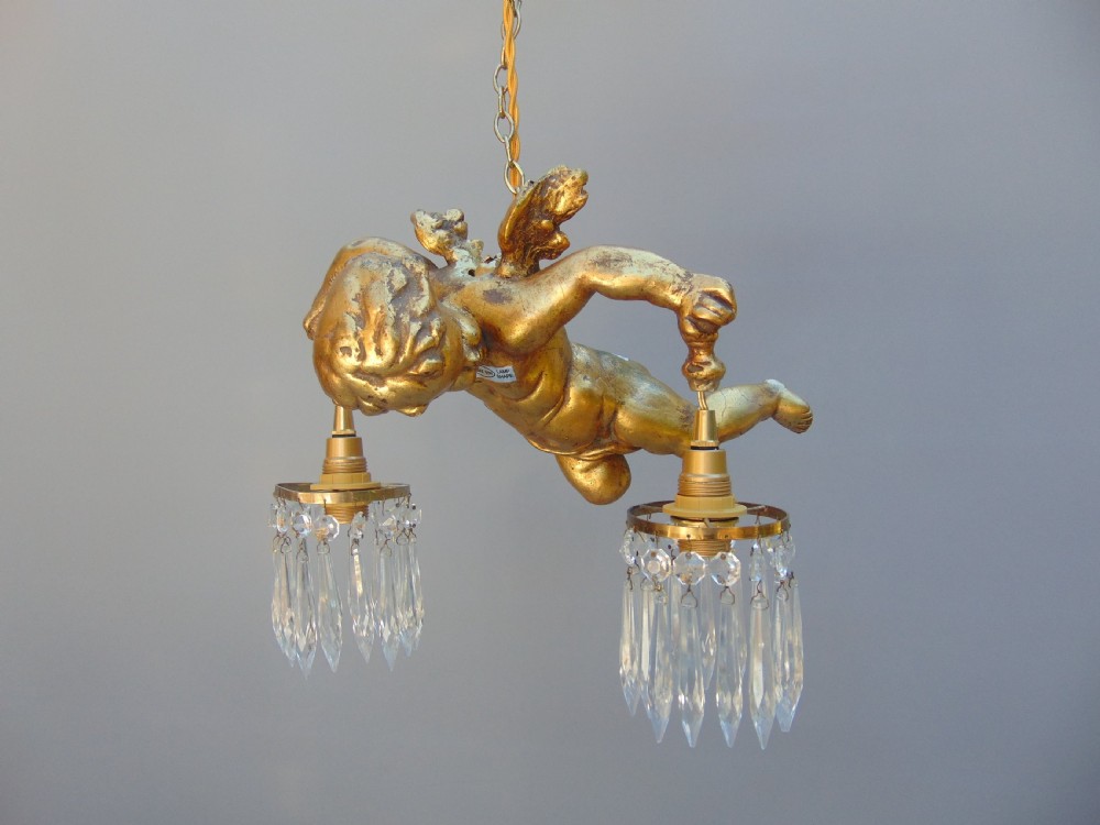 A gilded cherub ceiling light 