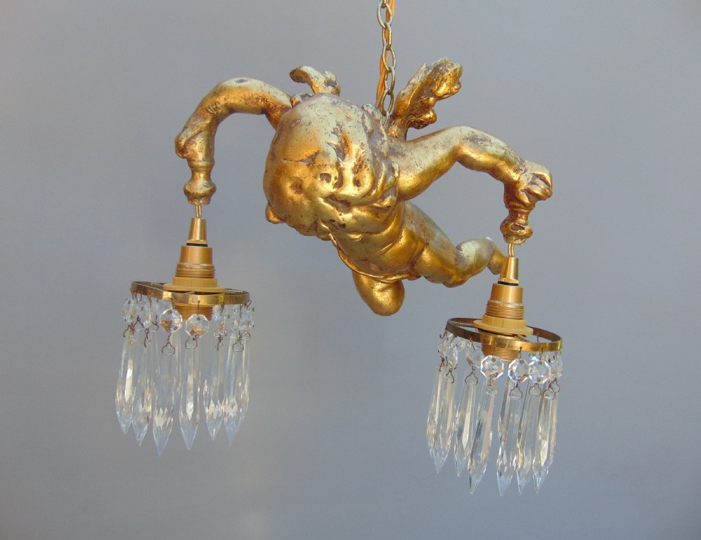 A gilded cherub ceiling light  View II