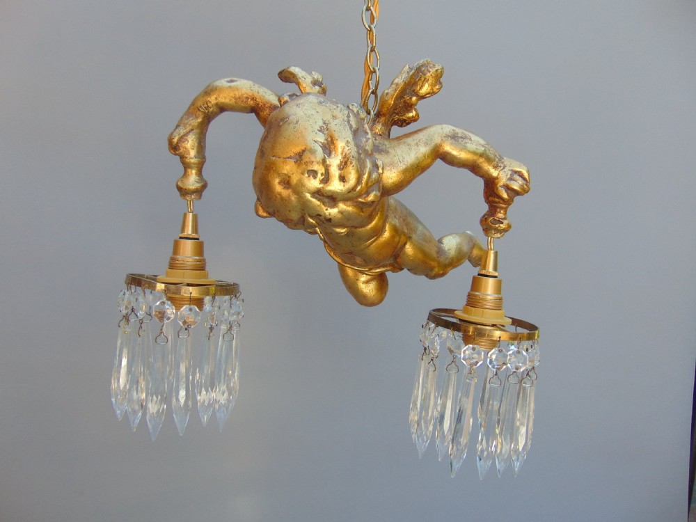 A gilded cherub ceiling light  View III