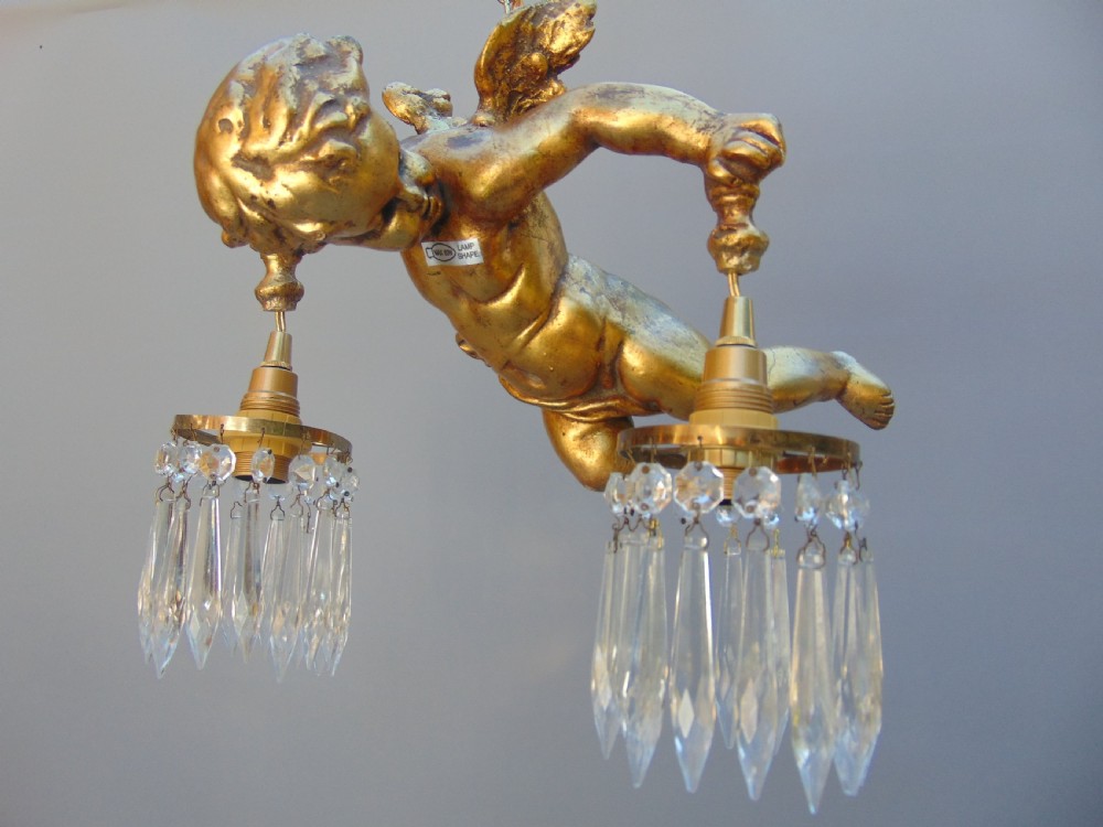 A gilded cherub ceiling light  View IV
