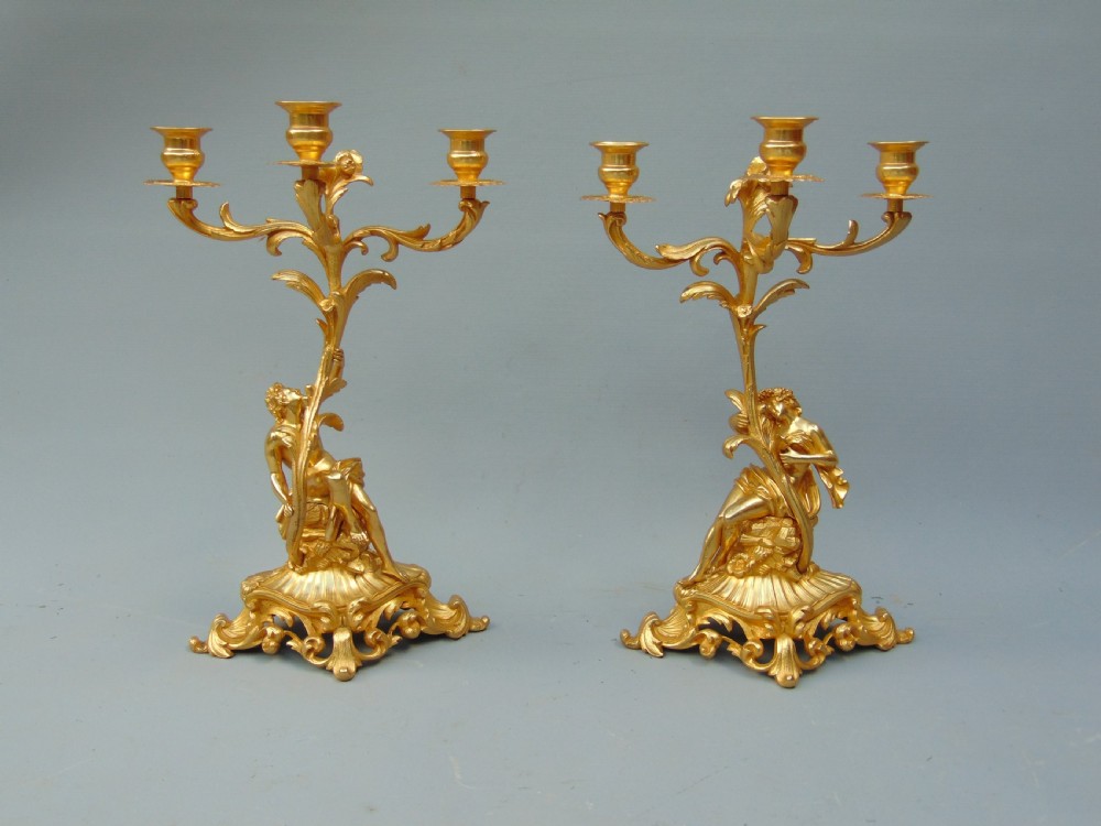 A superb pair of ormolu candlesticks 