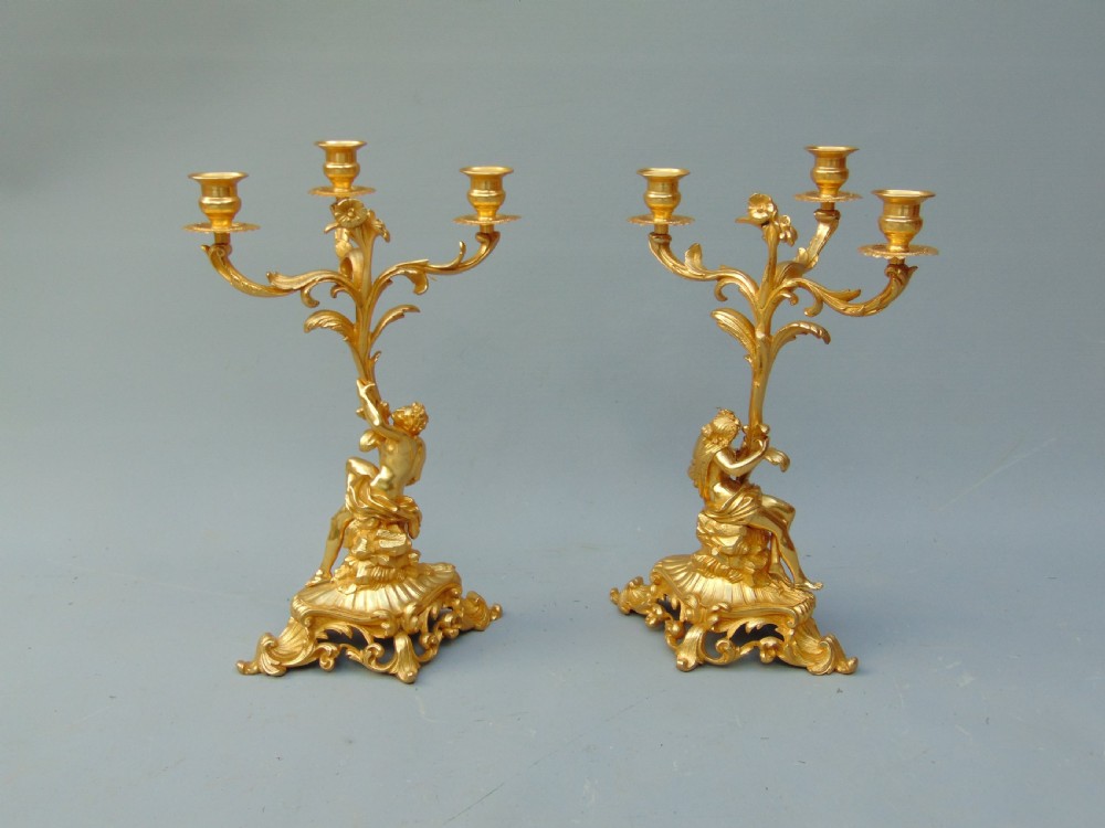 A superb pair of ormolu candlesticks  View VI