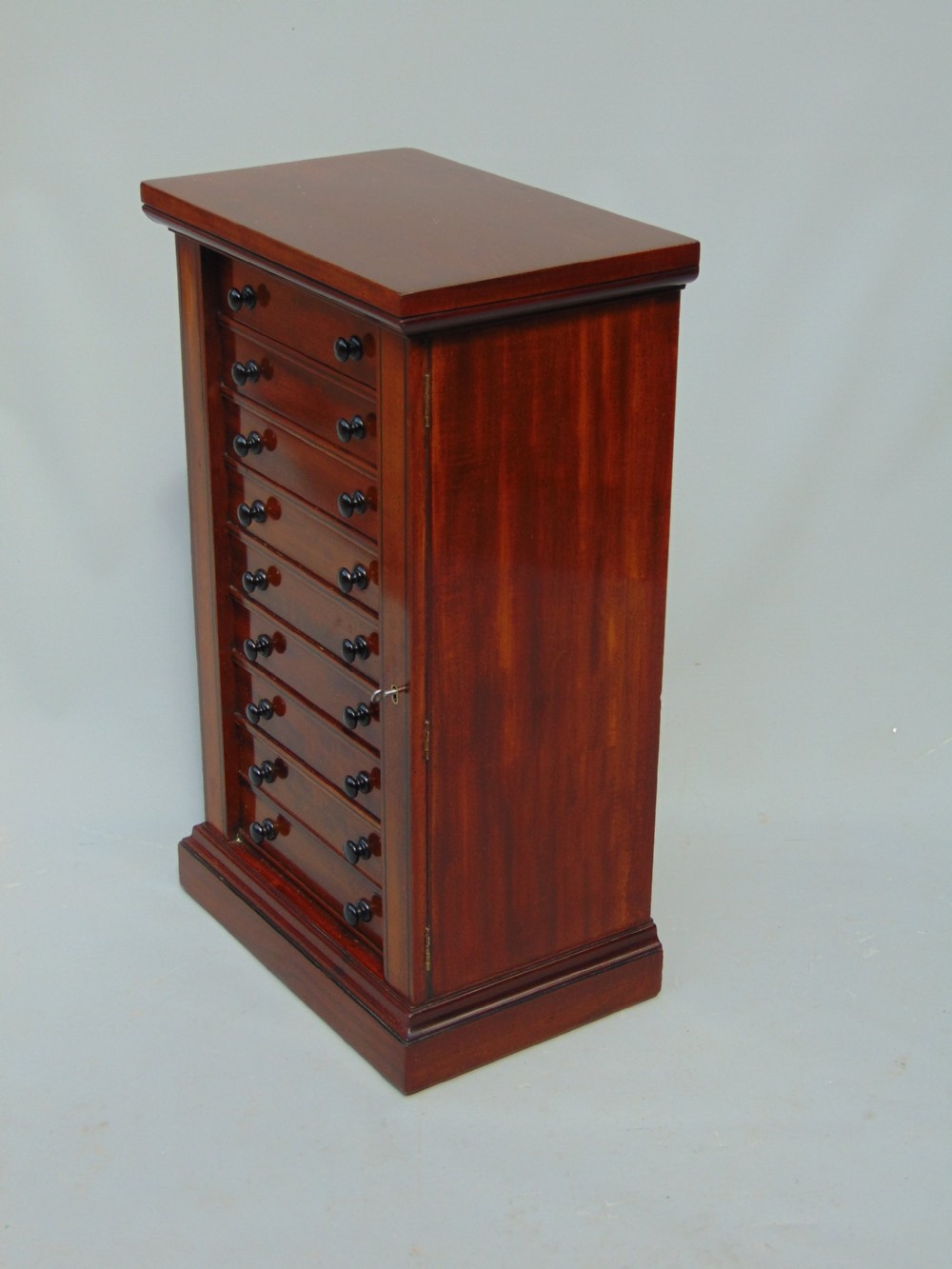 A quality Mahogany miniature wellington chest collectors cabinet View II