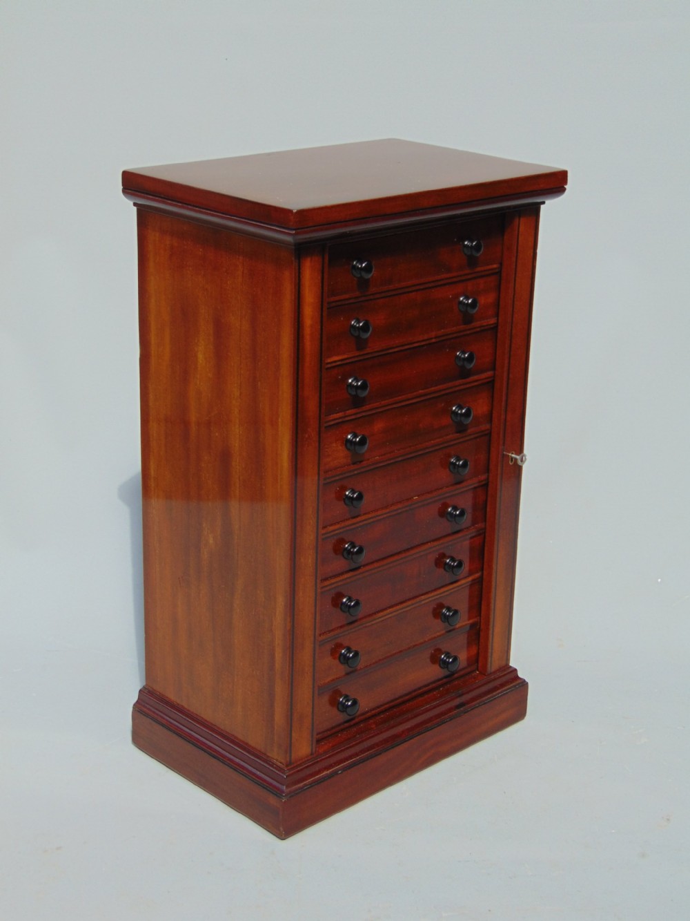 A quality Mahogany miniature wellington chest collectors cabinet View III