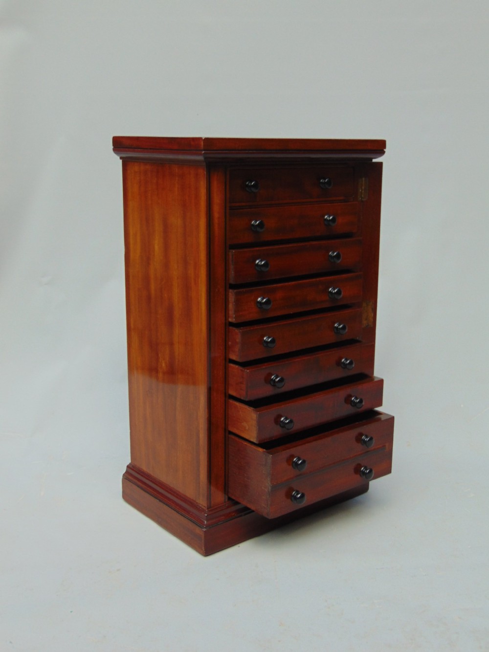 A quality Mahogany miniature wellington chest collectors cabinet View IV