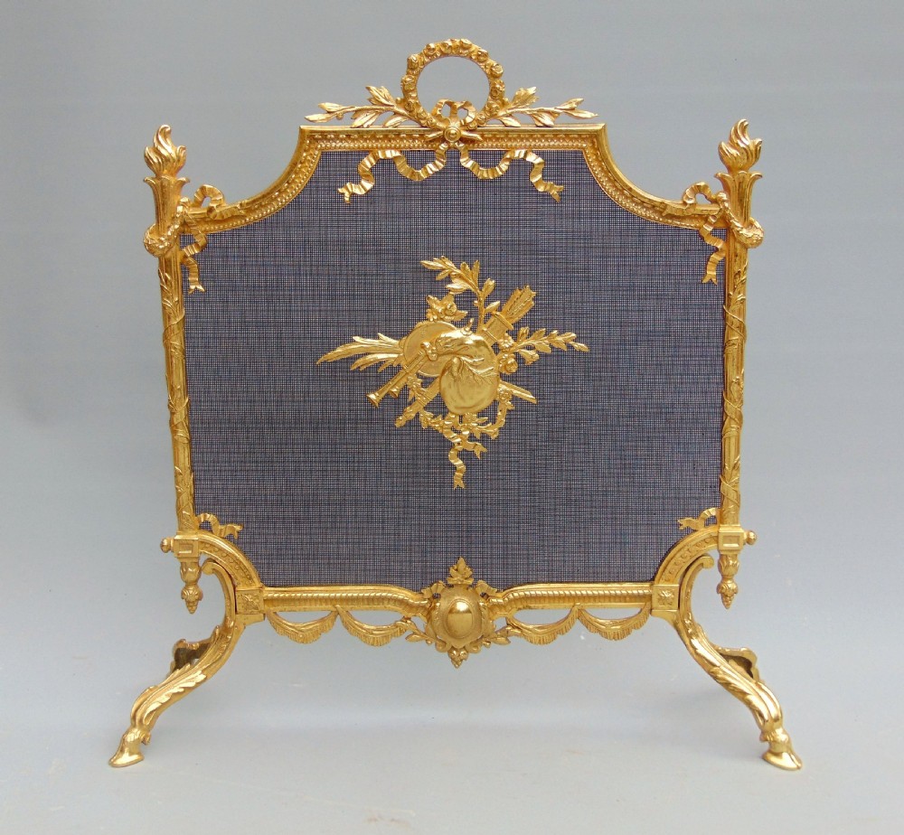 A antique ormolu fire screen guard 
