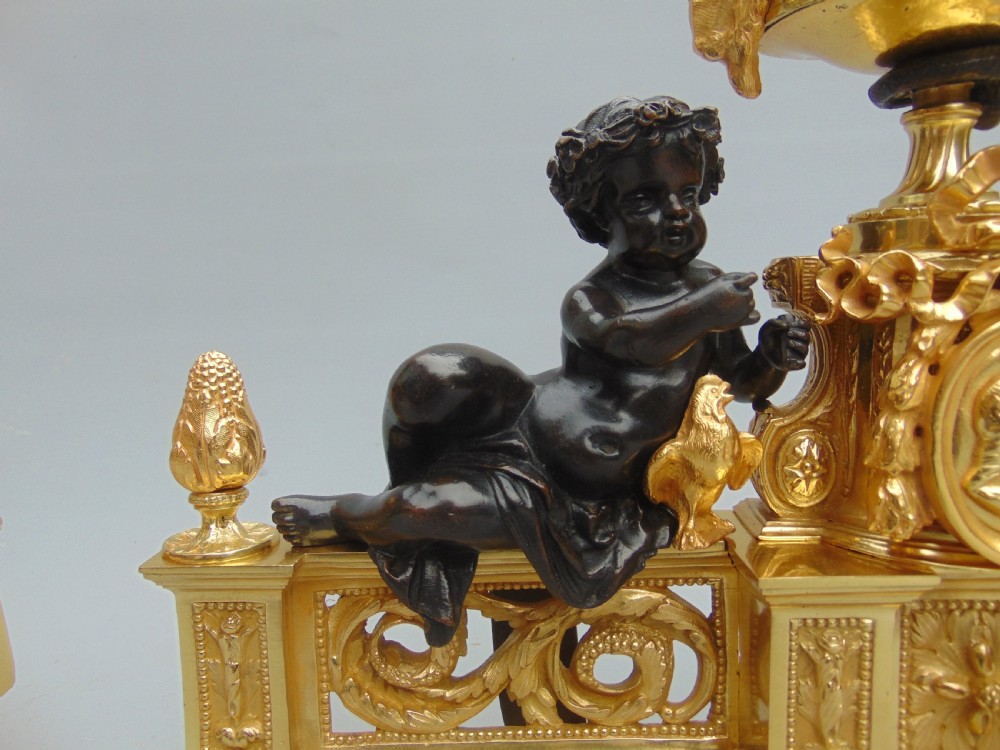 an impressive pair of Ormolu and Bronze Chenet andirons  View V