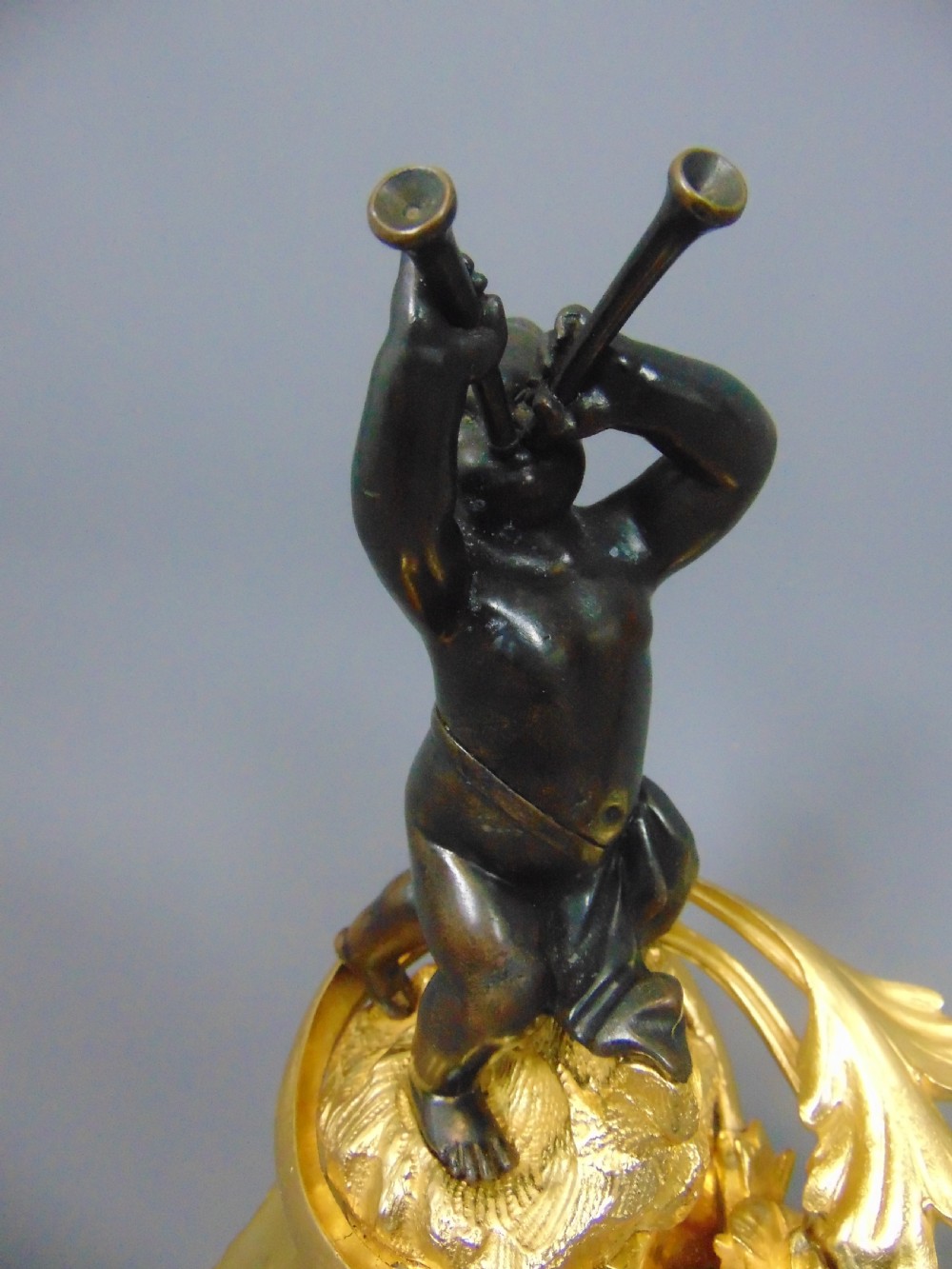 A Gilt and Bronze Cherub Chenet Fender  View III