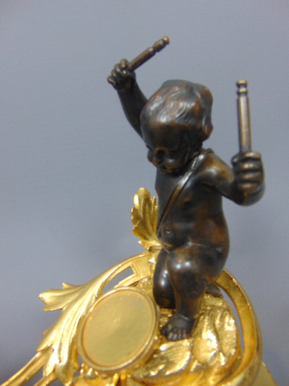 A Gilt and Bronze Cherub Chenet Fender  View IV