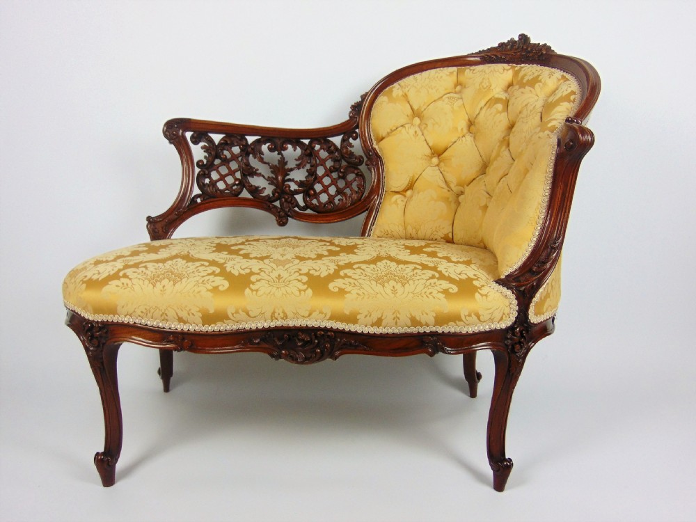 A superb walnut petite settee
