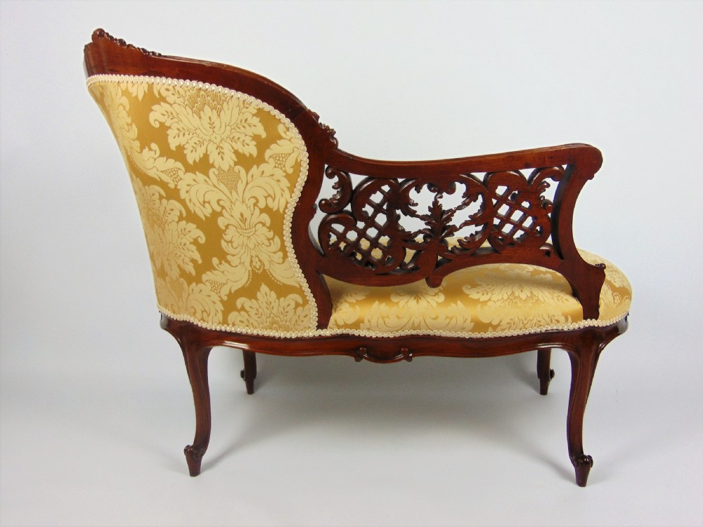 A superb walnut petite settee View VI