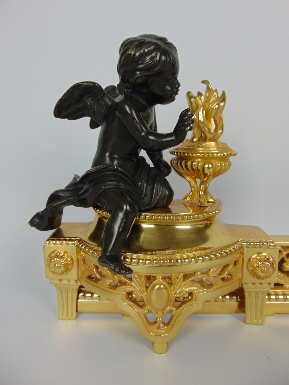 A  Bronze cherub Chenet Fender View III
