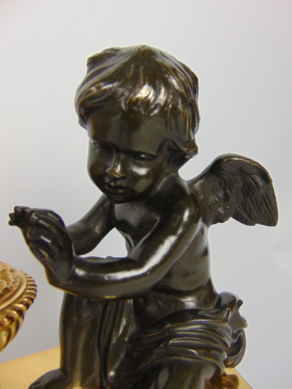 A  Bronze cherub Chenet Fender View V