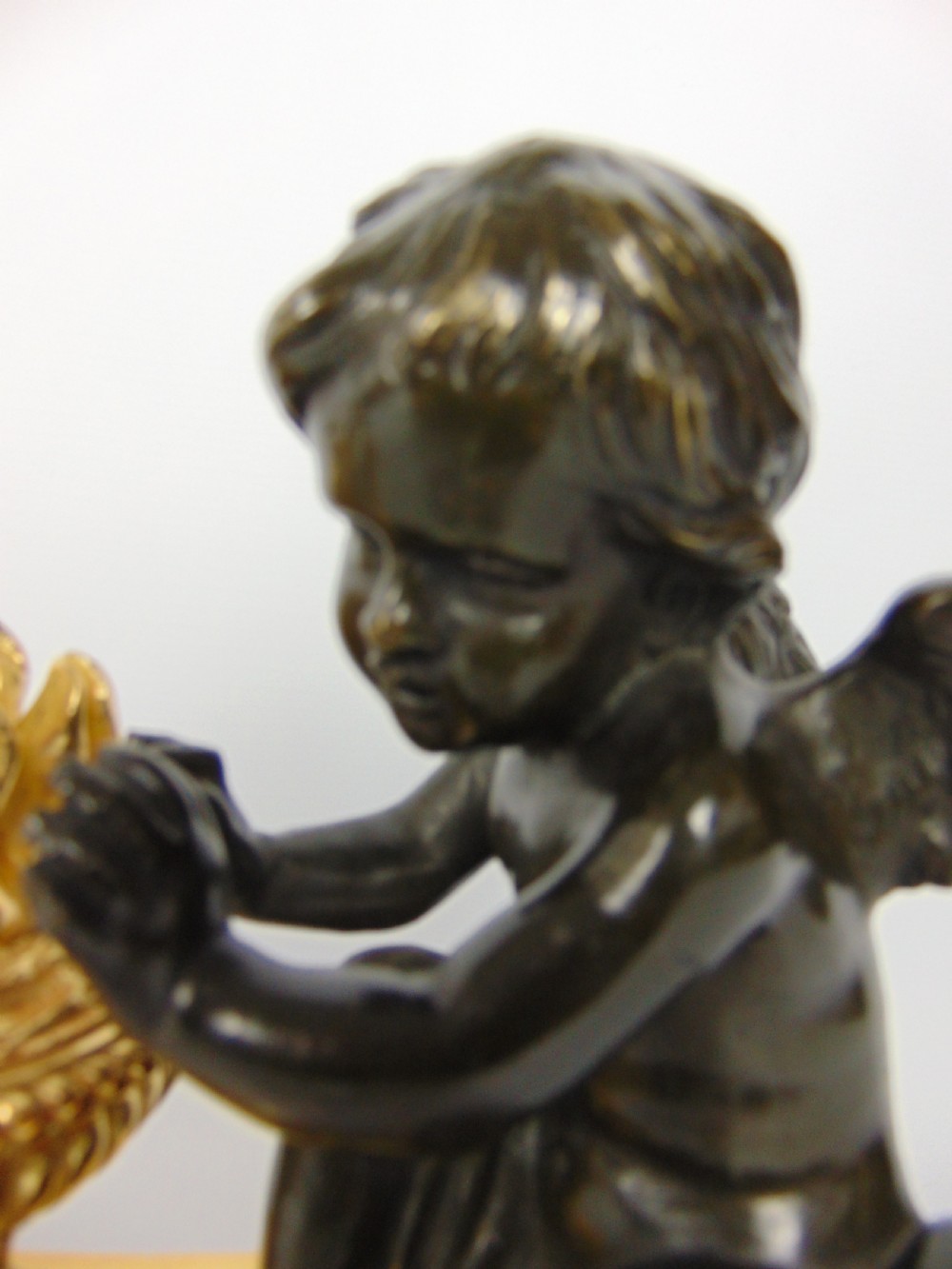 A  Bronze cherub Chenet Fender View VI