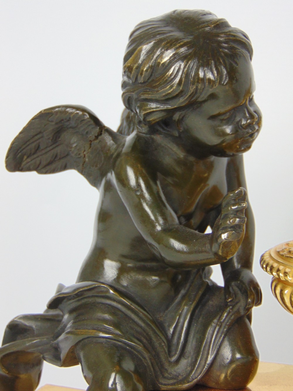 A  Bronze cherub Chenet Fender View VII
