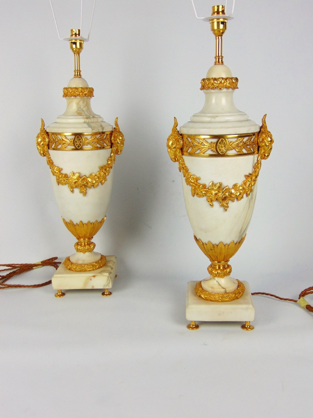 A large pair of white marble lamps 