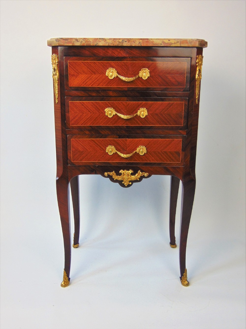 a petite  french chest of drawers