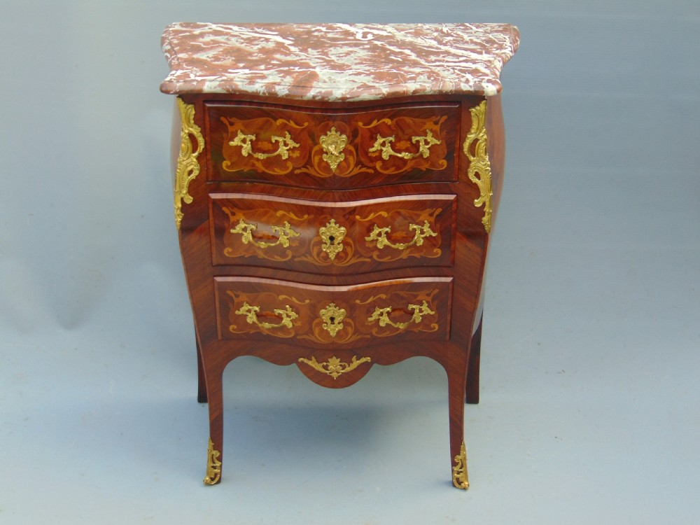 A fine  French Rosewood bombe shaped chest of drawers
