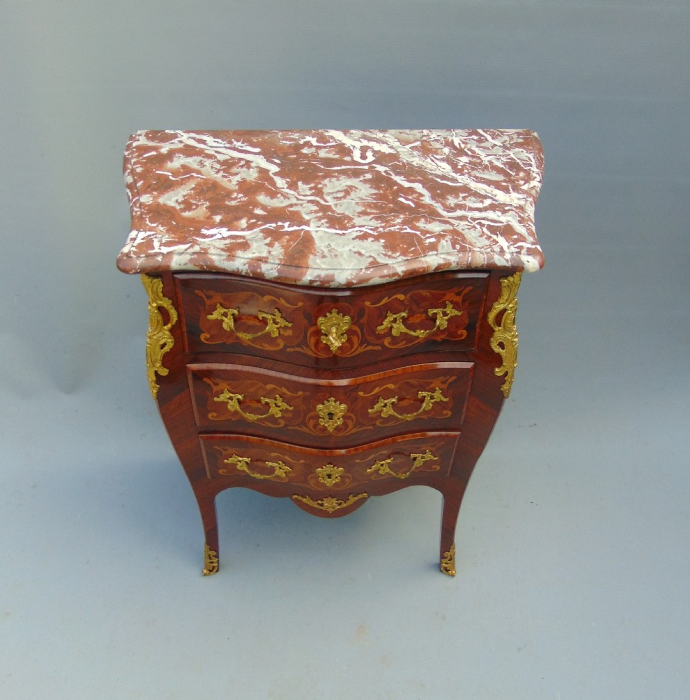 A fine  French Rosewood bombe shaped chest of drawers View II