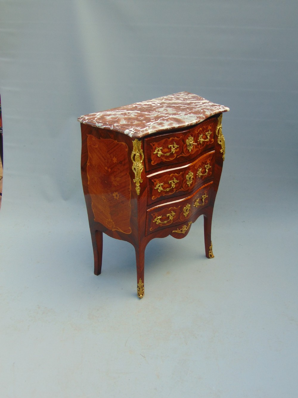 A fine  French Rosewood bombe shaped chest of drawers View III