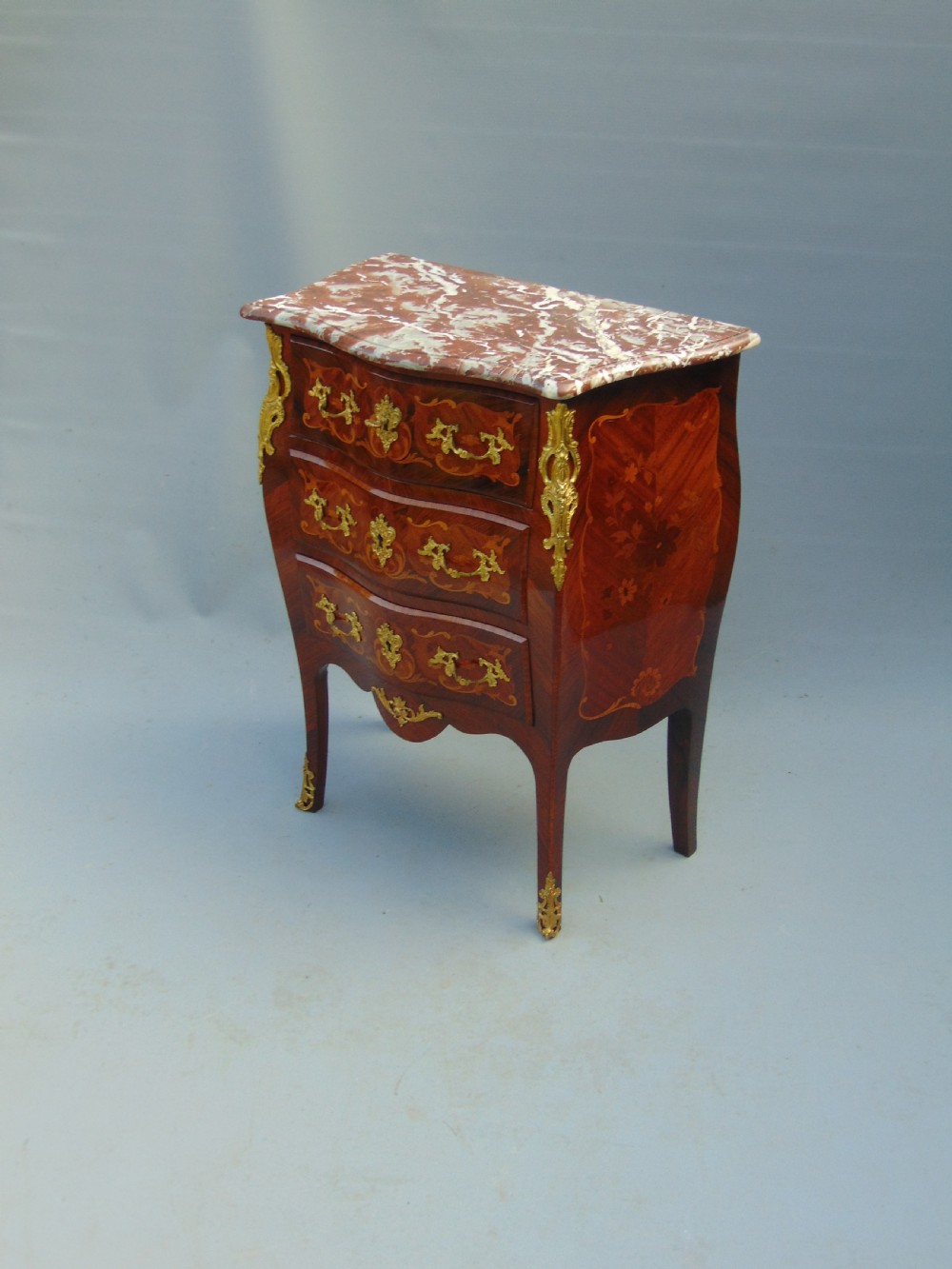 A fine  French Rosewood bombe shaped chest of drawers View IV