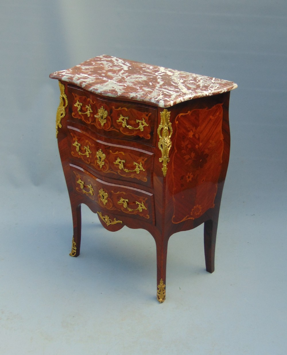 A fine  French Rosewood bombe shaped chest of drawers View V
