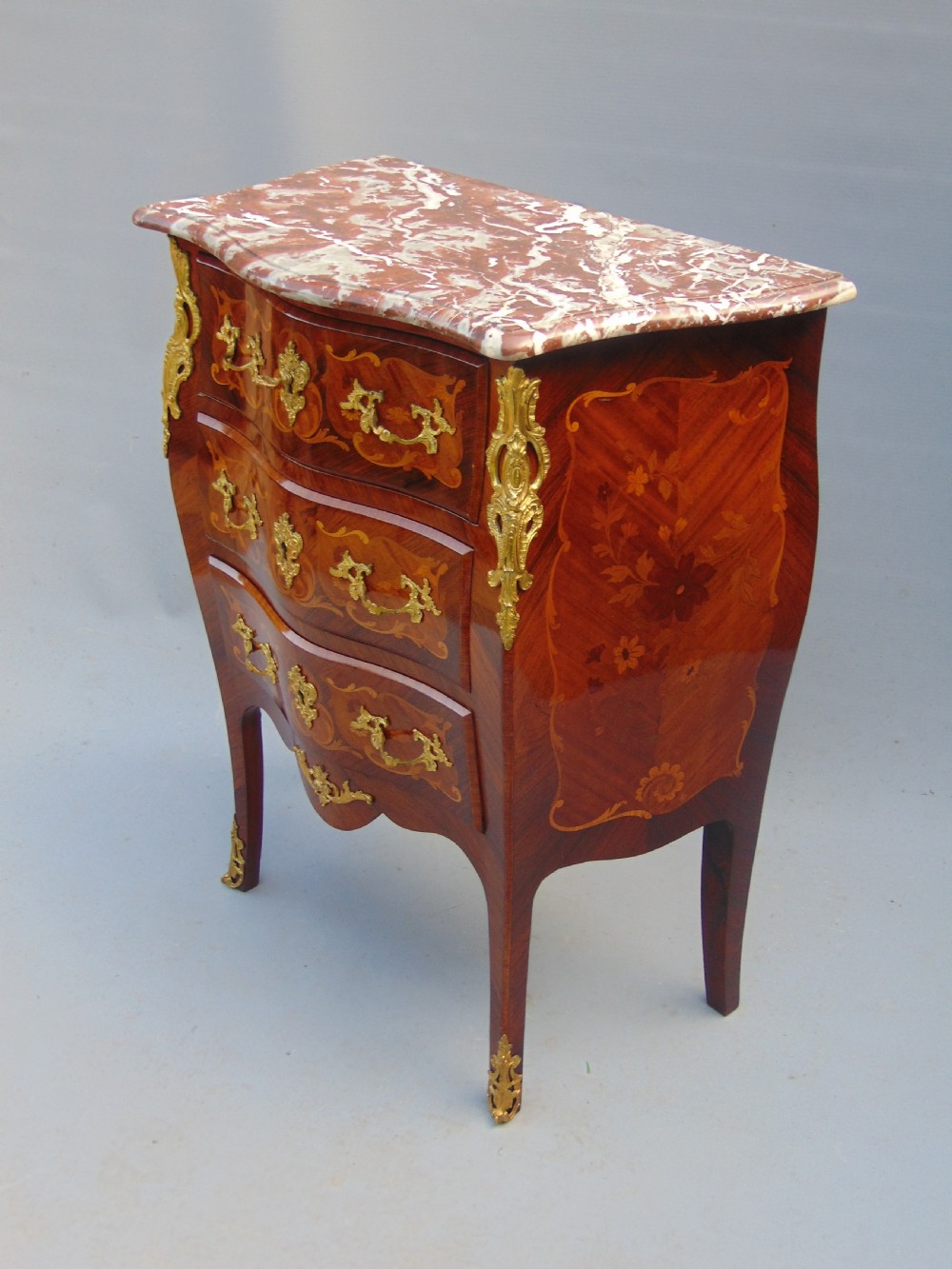 A fine  French Rosewood bombe shaped chest of drawers View VI