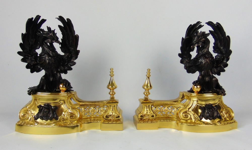 A rare pair of phoenix chenet andirons 