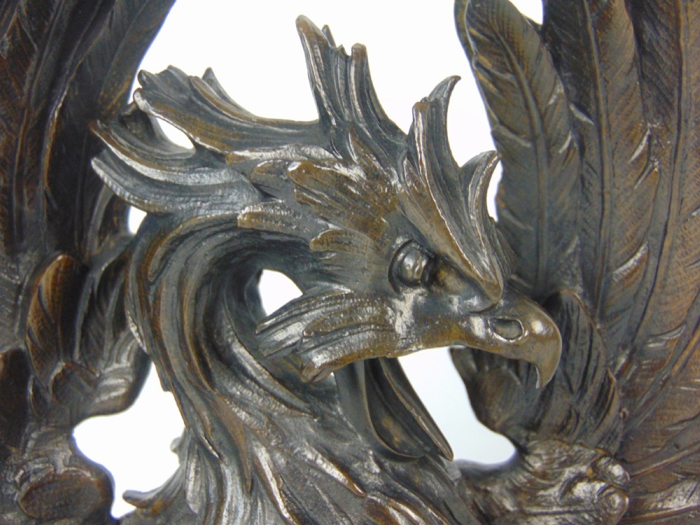 A rare pair of phoenix chenet andirons  View II