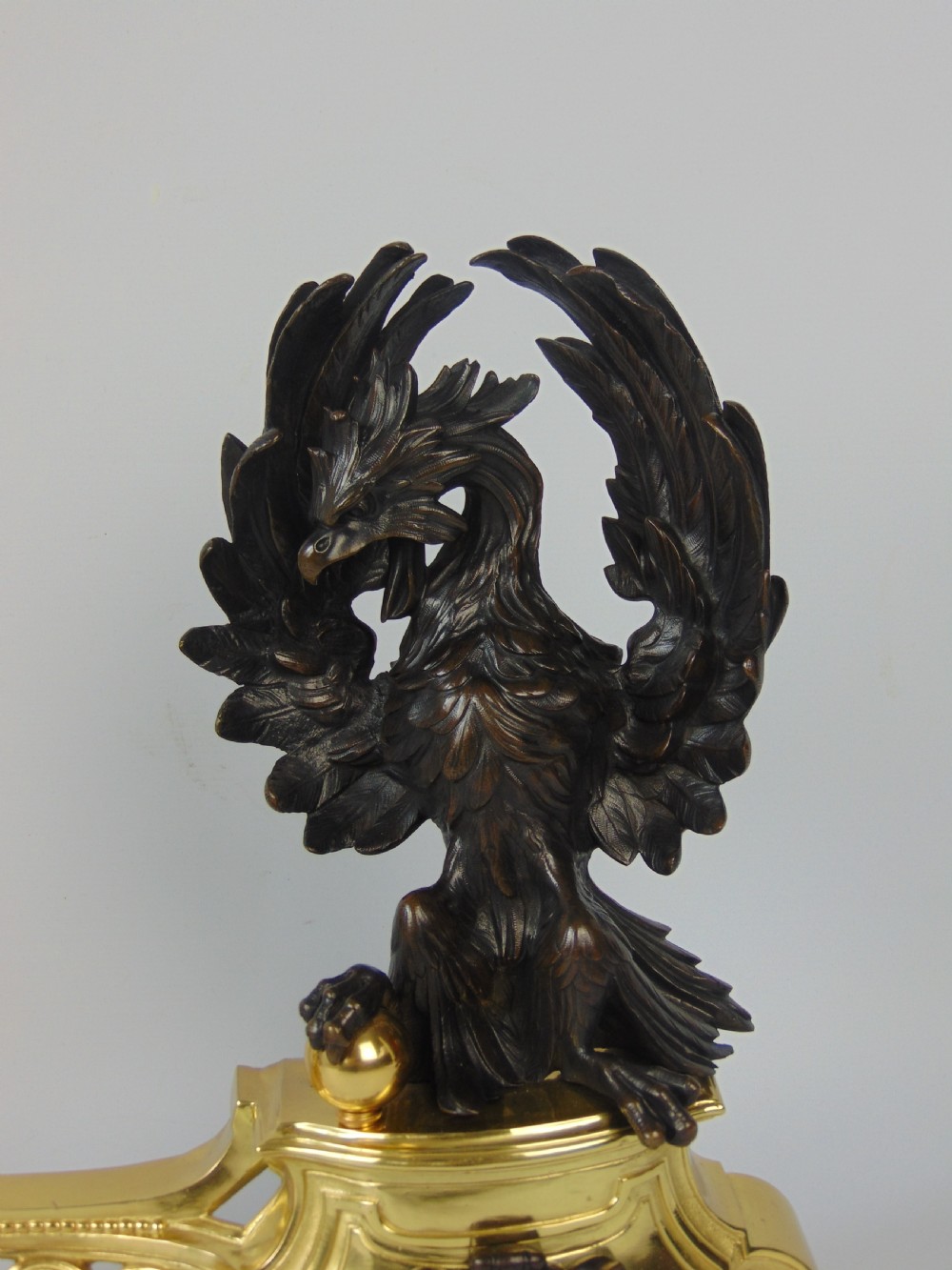 A rare pair of phoenix chenet andirons  View V
