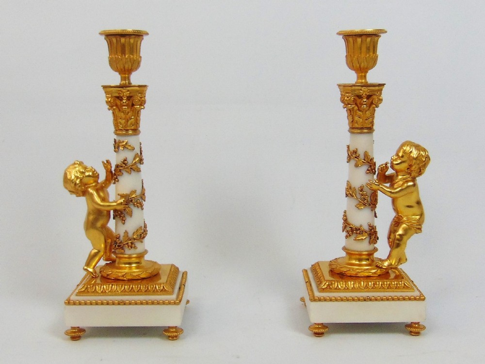 A superb pair of Marble and Ormolu Candlesticks 