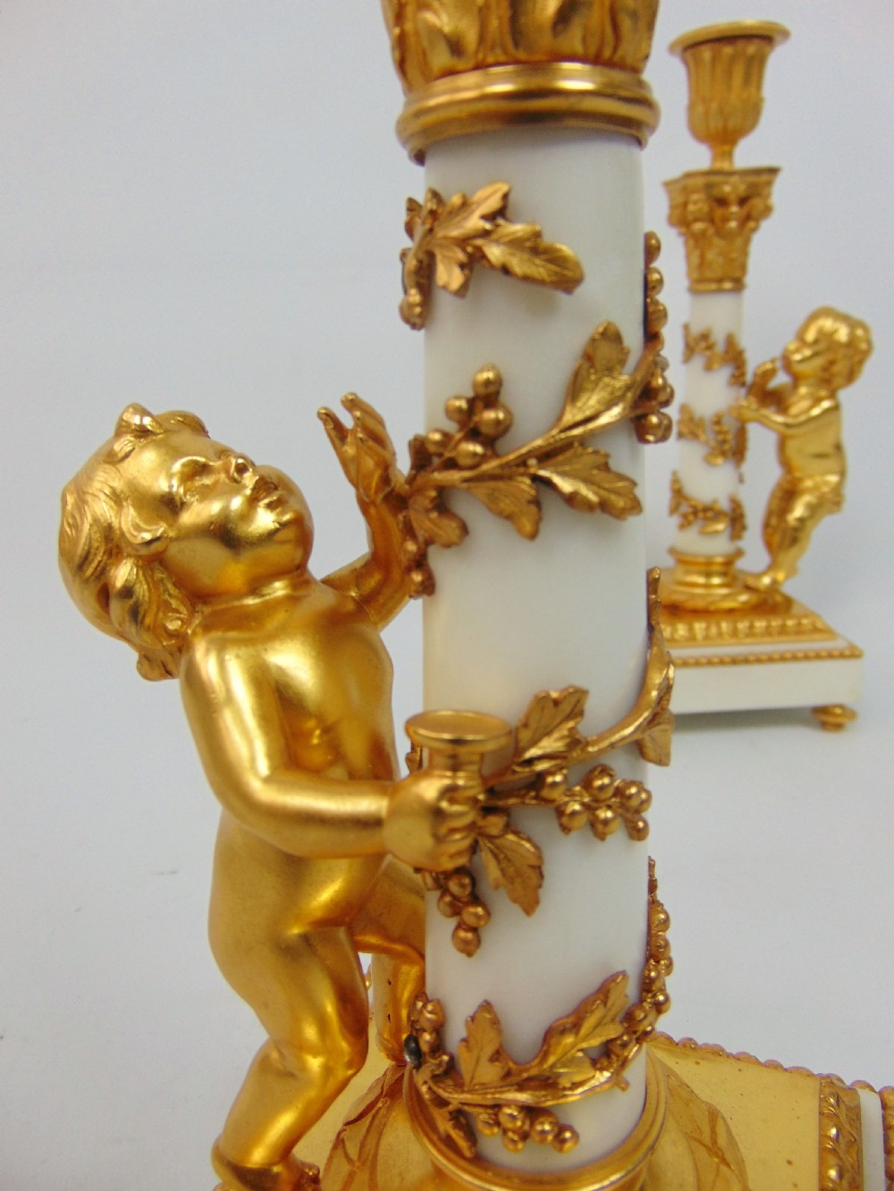 A superb pair of Marble and Ormolu Candlesticks  View II