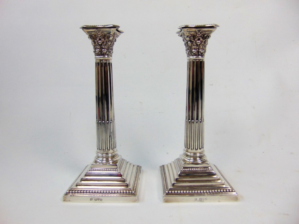  a fine pair pair of silver candlesticks by barker bros